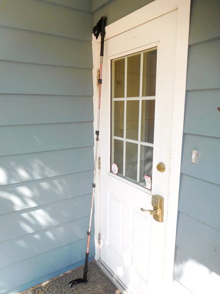With the two trekking poles together, the now one pole can be longer than a door is tall.