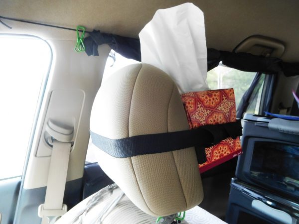 Tissue box strapped to a headrest
