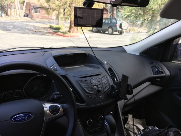 A Garmin GPS is mounted to the windshield below the rearview mirror. Standalone GPS units are great to have while on the road because they do not require any cellular signal. Great for driving through those remote areas.