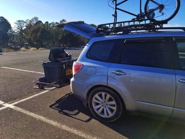 A trailer hitch cargo carrier on the Subaru Forester